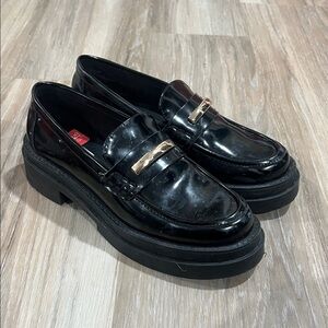 Steve Madden Glossy Black Loafers with Gold Accent